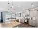Beautiful kitchen with granite countertops, stainless steel appliances, and a large island overlooking the dining area at 115 Cliffview Dr, Garner, NC 27529