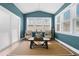Bright sunroom features a vaulted ceiling, neutral decor, and natural light, making it an inviting space for relaxation at 115 Cliffview Dr, Garner, NC 27529