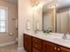 Bathroom features double sinks with granite countertop and walk-in shower at 11619 John Allen Road Rd, Raleigh, NC 27614