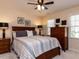 Bedroom featuring a wood bed frame, neutral walls, and a ceiling fan at 11619 John Allen Road Rd, Raleigh, NC 27614