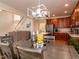 Open concept dining room with modern lighting connected to the living room and kitchen at 11619 John Allen Road Rd, Raleigh, NC 27614