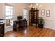 Cozy home office space with a desk, chair, and elegant wooden cabinet at 11619 John Allen Road Rd, Raleigh, NC 27614