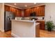 Well-equipped kitchen with wooden cabinets, stainless steel appliances, and an island at 11619 John Allen Road Rd, Raleigh, NC 27614