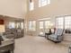 Spacious living room with high ceilings, large windows, and comfortable seating at 11619 John Allen Road Rd, Raleigh, NC 27614