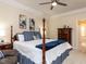 Spacious main bedroom with a four-poster bed, dresser, and comfortable sitting area at 11619 John Allen Road Rd, Raleigh, NC 27614