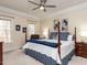 Cozy main bedroom featuring a four-poster bed, neutral walls, and ample natural light at 11619 John Allen Road Rd, Raleigh, NC 27614