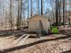 Exterior view of outbuilding with ramps, adjacent to wooded lot at 11619 John Allen Road Rd, Raleigh, NC 27614
