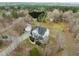 Aerial view of the home showcasing a large lot, established trees, detached garage at 1210 Poplar Forest Lane Ln, Pittsboro, NC 27312