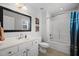 Bathroom with tile floor, single vanity, toilet and shower with blue curtain at 1210 Poplar Forest Lane Ln, Pittsboro, NC 27312