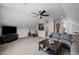 Spacious bonus room with guitars, a TV, and comfortable seating, perfect for entertainment and relaxation at 1210 Poplar Forest Lane Ln, Pittsboro, NC 27312