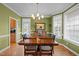 Inviting dining room featuring a large wooden table, chandelier, and view to the kitchen at 1210 Poplar Forest Lane Ln, Pittsboro, NC 27312