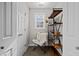 This is a small office space with neutral walls, a chair, bookshelf, and a window to let in some natural light at 1210 Poplar Forest Lane Ln, Pittsboro, NC 27312