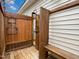 Rustic outdoor shower featuring a wooden enclosure and bench, offering privacy at 1210 Poplar Forest Lane Ln, Pittsboro, NC 27312