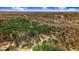 Panoramic aerial perspective of a community immersed in a lush forest with a clear blue sky above at 129 Bennett Pl, Clayton, NC 27527