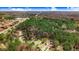 Wide aerial shot of a residential area with homes nestled among trees and a highway in the background at 129 Bennett Pl, Clayton, NC 27527