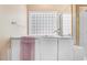 This bright bathroom features a walk-in shower and separate jacuzzi bathtub at 129 Bennett Pl, Clayton, NC 27527