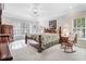 Comfortable bedroom features a spacious layout, large windows, and ceiling fan at 129 Bennett Pl, Clayton, NC 27527
