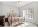 Inviting bedroom with plush carpet, natural light and brass bed frame at 129 Bennett Pl, Clayton, NC 27527