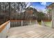 Spacious wooden deck overlooking a lush, green yard with a view of the surrounding trees at 129 Bennett Pl, Clayton, NC 27527