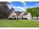 Attractive single-story home featuring a well-kept lawn and manicured landscaping at 129 Bennett Pl, Clayton, NC 27527