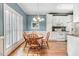 Charming breakfast nook with white cabinets and stainless appliances near kitchen at 129 Bennett Pl, Clayton, NC 27527