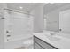 Clean, modern bathroom with a gray vanity, white toilet, and tub with shower creates a functional space at 1434 Rosepine Dr, Cary, NC 27519