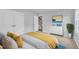 Bright bedroom with a large bed, white dresser, and closet doors creates a calm and inviting space at 1434 Rosepine Dr, Cary, NC 27519