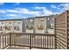 Townhome community featuring garages, decks and attractive exteriors as seen from a wood deck at 1434 Rosepine Dr, Cary, NC 27519