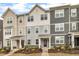 Attractive townhome exteriors with varied colors, well-maintained landscaping, and inviting front porches at 1434 Rosepine Dr, Cary, NC 27519