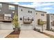 Well-maintained townhomes with garages, decks, and tidy landscaping present desirable curb appeal at 1434 Rosepine Dr, Cary, NC 27519