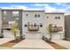 Charming townhomes feature attached garages, private balconies, and neutral-colored siding, complemented by landscaped front yards at 1434 Rosepine Dr, Cary, NC 27519