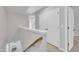 Upstairs hallway featuring two large double door closets, and neutral colored paint at 1434 Rosepine Dr, Cary, NC 27519