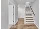 View of a staircase with wood and white trim, set within a home's interior at 1434 Rosepine Dr, Cary, NC 27519