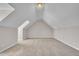 This attic space is a blank canvas, ready to be converted into your dream room or extra storage with neutral walls and carpet at 147 Tralee Dr, Smithfield, NC 27577
