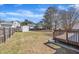 Spacious backyard with a wooden deck, storage shed, and fenced perimeter for privacy at 147 Tralee Dr, Smithfield, NC 27577
