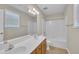 Bright bathroom featuring a double sink vanity and a combined shower and tub at 147 Tralee Dr, Smithfield, NC 27577