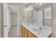 Bright bathroom featuring a double sink vanity with a framed mirror at 147 Tralee Dr, Smithfield, NC 27577