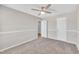 Bedroom featuring neutral carpet, a ceiling fan, and access to other rooms at 147 Tralee Dr, Smithfield, NC 27577