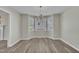 Open dining room with wood flooring, chandelier, and natural light from bay windows at 147 Tralee Dr, Smithfield, NC 27577