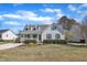 Charming single-Gathering home with a welcoming front porch, well-maintained lawn, and beautiful landscaping at 147 Tralee Dr, Smithfield, NC 27577