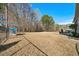 Large backyard with a swing set, playhouse, and mature trees at 153 Brindley Cir, Clayton, NC 27520