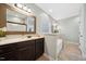 Bathroom featuring a soaking tub, walk in shower, and dark wood cabinets at 153 Brindley Cir, Clayton, NC 27520
