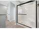 Bathroom showcasing a glass enclosed shower with a white tile surround at 153 Brindley Cir, Clayton, NC 27520