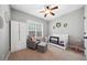 Cozy Bedroom with a crib, glider chair, ottoman, and neutral decor at 153 Brindley Cir, Clayton, NC 27520