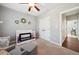 Bedroom with a glider, white crib, closet, and neutral gray walls at 153 Brindley Cir, Clayton, NC 27520