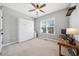 Cozy bedroom with a murphy bed, window, desk, and neutral carpet at 153 Brindley Cir, Clayton, NC 27520