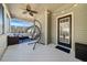 Screened in porch with seating, a chair swing, and a ceiling fan at 153 Brindley Cir, Clayton, NC 27520