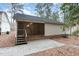Backyard featuring a charming screened porch, complemented by a brick patio for outdoor enjoyment at 1603 Stonegate S, Sanford, NC 27332