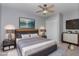 Well-staged bedroom with a ceiling fan, and stylish decor creating a relaxing atmosphere at 1603 Stonegate S, Sanford, NC 27332