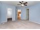 Spacious bedroom with a view of the kitchen and an open closet at 1603 Stonegate S, Sanford, NC 27332